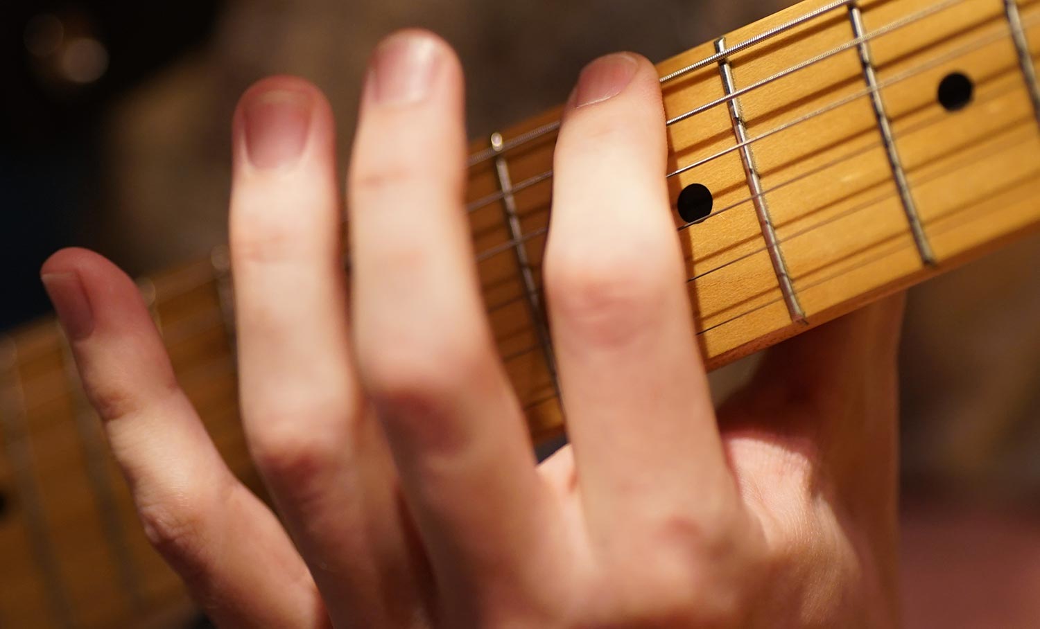 Muting guitar string with fingerprint side